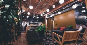 TES Location - Wood style room with lights and a seating area.