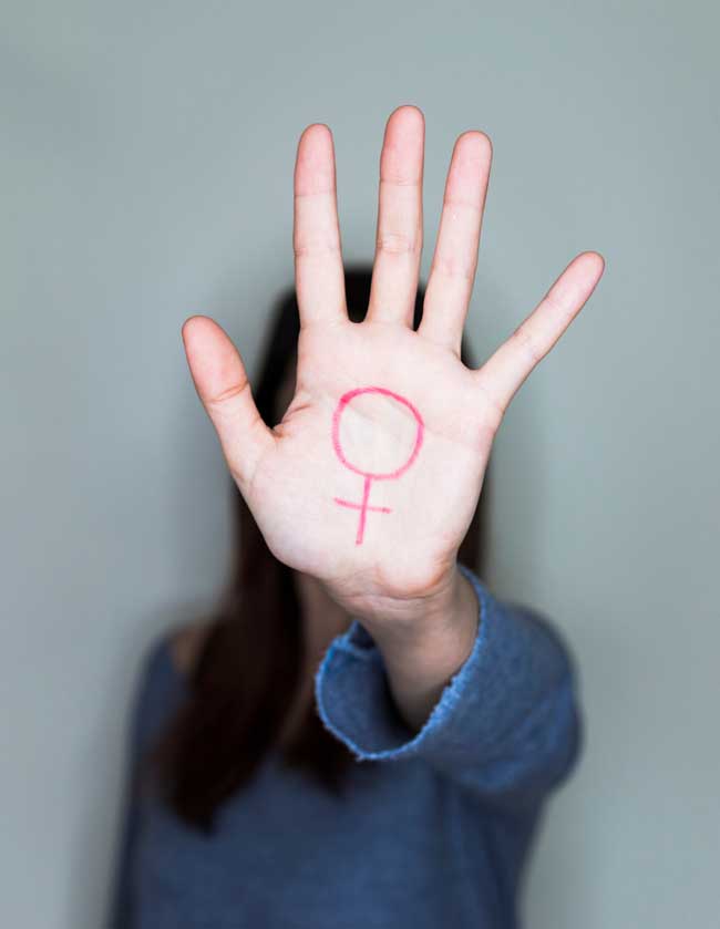 women with equality symbol on her hand
