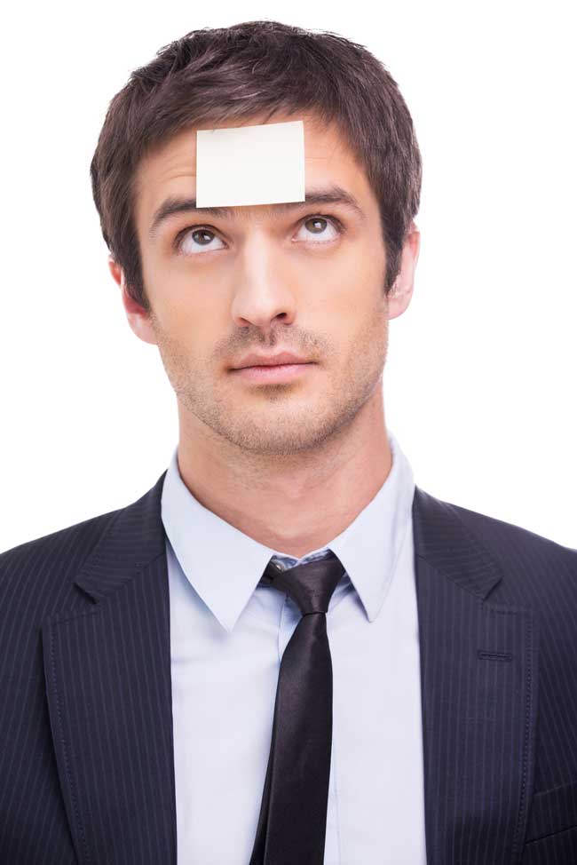 man with stick-it note on forehead