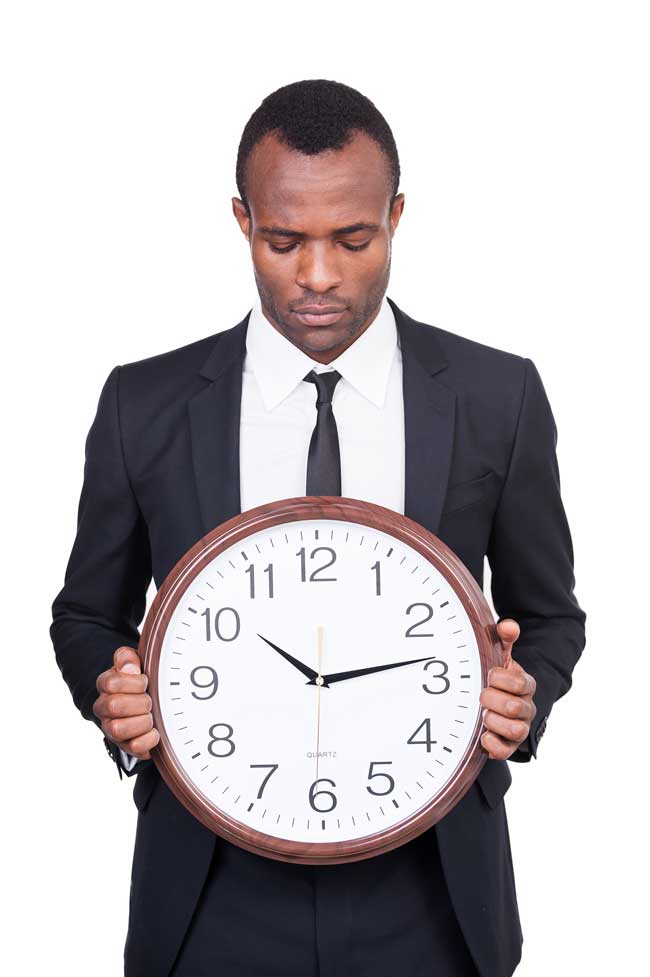man holding clock