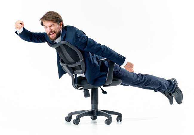 corporate escapee image of man flying an office chair