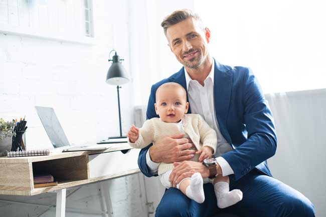 happy-businessman-holding-infant-daughter-650px career goals