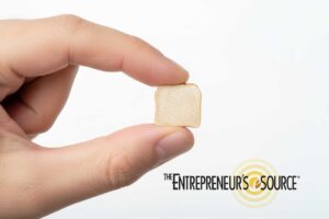 holding miniature slice of bread