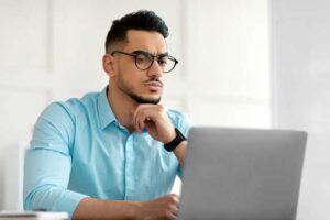curious man at laptop