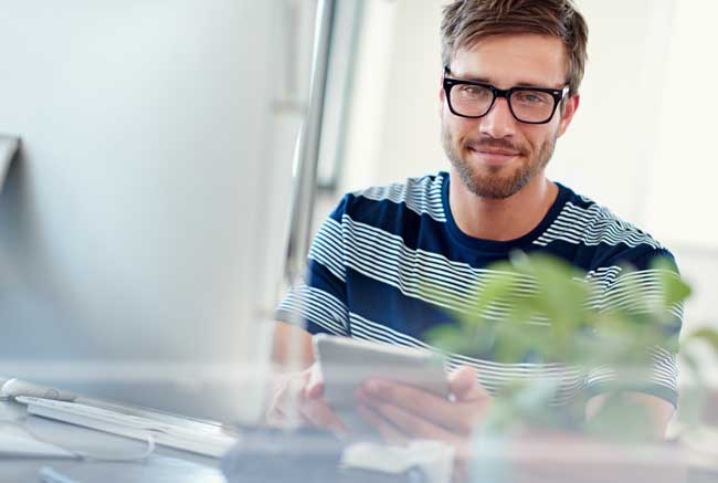confident-man-using-tablet