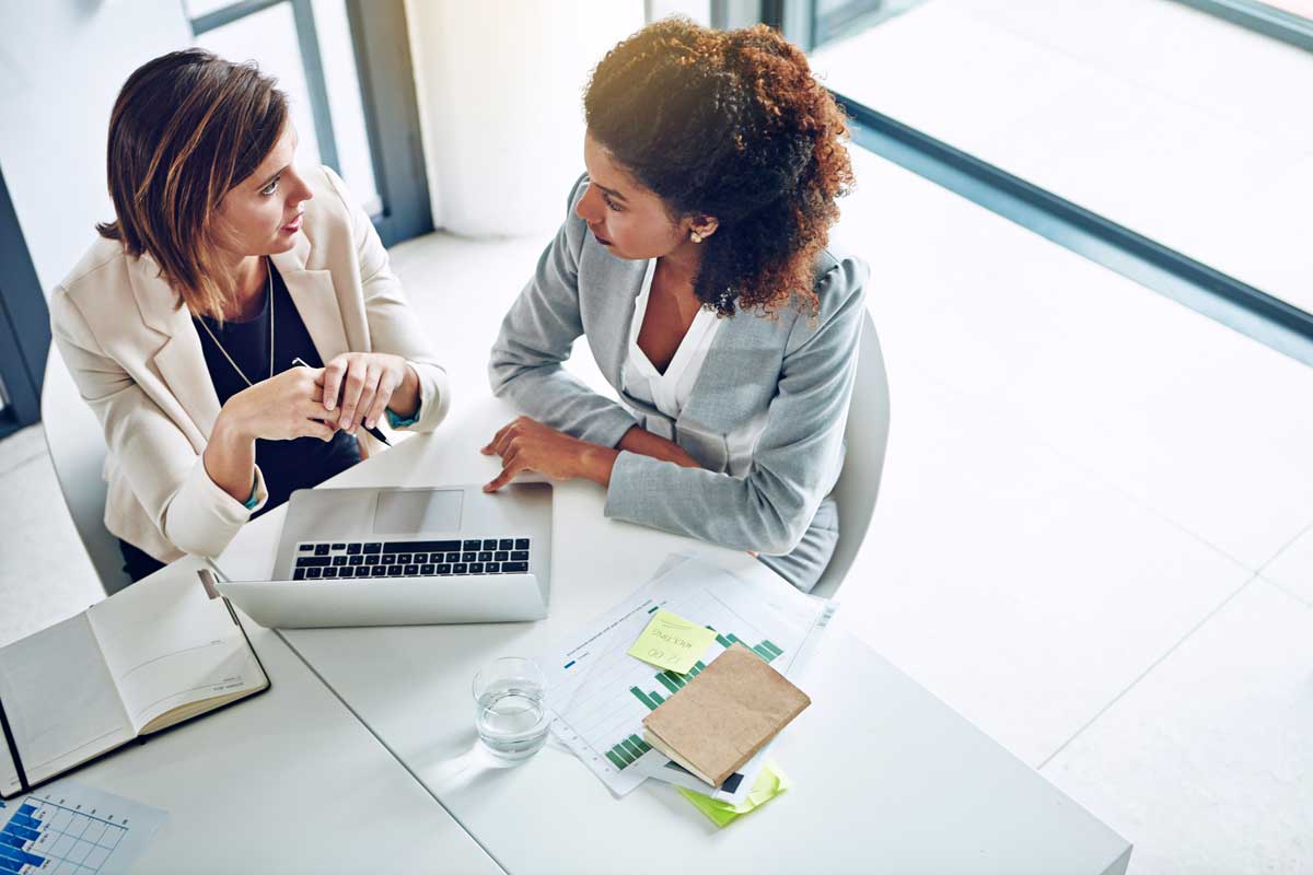 wo people talking across a table, with real engagement
